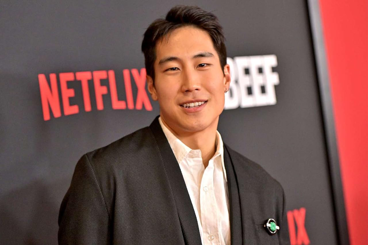 Mazino at a photoshoot with a Netflix Beef backdrop